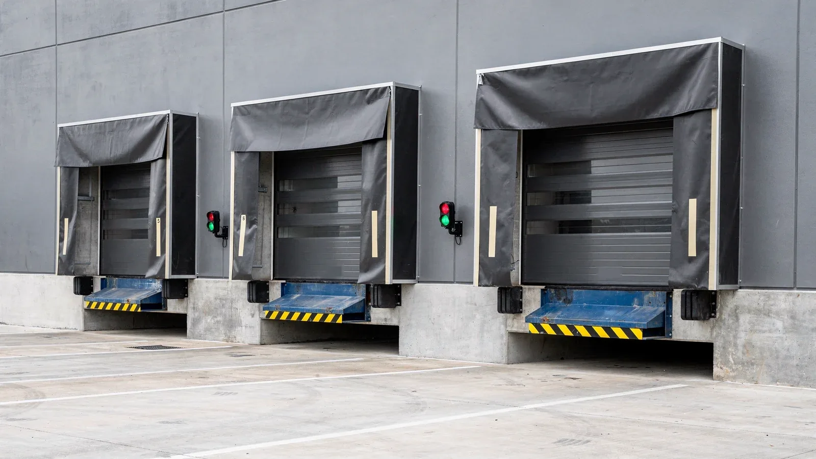 Row of retractable dock shelters over loading bays with blue dock levellers